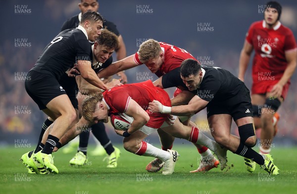 221125 - Wales v New Zealand All Blacks - Quilter Nations Series - Blair Murray of Wales is tackled by Cortez Ratima of New Zealand 