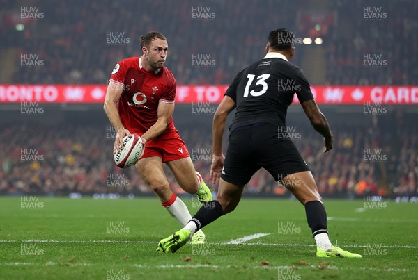 221125 - Wales v New Zealand All Blacks - Quilter Nations Series - Max Llewellyn of Wales is challenged by Rieko Ioane of New Zealand 