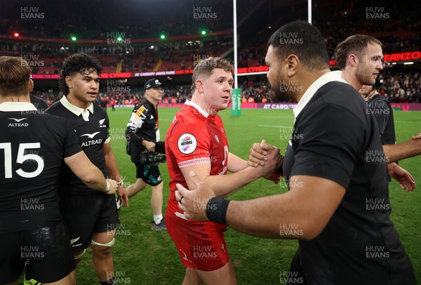 221125 - Wales v New Zealand All Blacks - Quilter Nations Series - Brodie Coghlan of Wales shakes hands with the opposition at full time