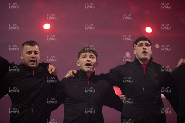 221125 - Wales v New Zealand All Blacks - Quilter Nations Series - Harri Deaves, Dan Edwards and Morgan Morse of Wales during the anthem