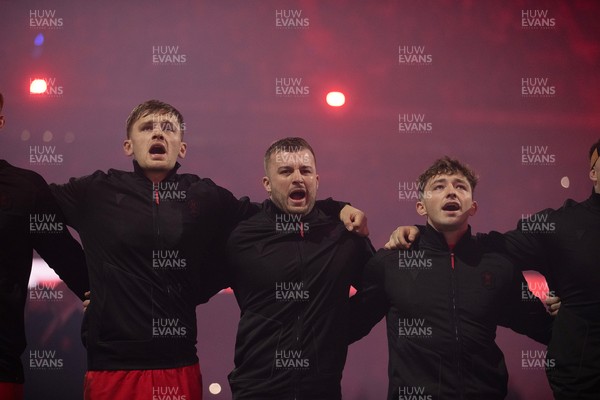 221125 - Wales v New Zealand All Blacks - Quilter Nations Series - Alex Mann, Harri Deaves and Dan Edwards of Wales during the anthem