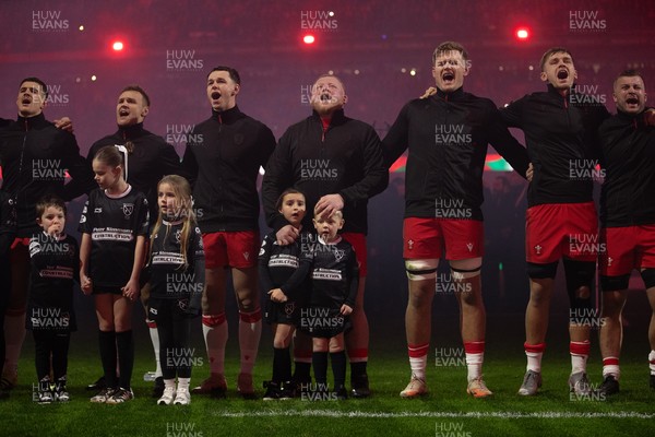 221125 - Wales v New Zealand All Blacks - Quilter Nations Series - Keiron Assiratti of Wales with his children during the anthem