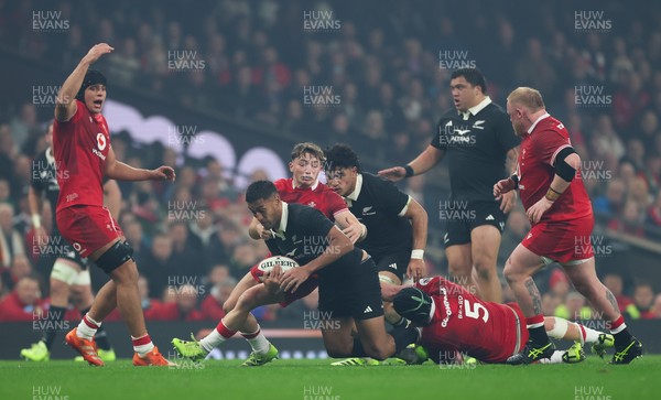 221125 - Wales v New Zealand, Quilter Nations Series - Rieko Ioane of New Zealand  is tackled by Adam Beard of Wales