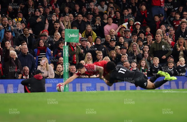 221125 - Wales v New Zealand, Quilter Nations Series - The crowd look on as Louis Rees-Zammit of Wales dives in to score try