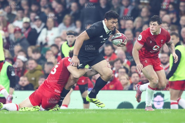 221125 - Wales v New Zealand - Quilter Nations Series - Anton Lienert-Brown of New Zealand is tackled by Max Llewellyn of Wales