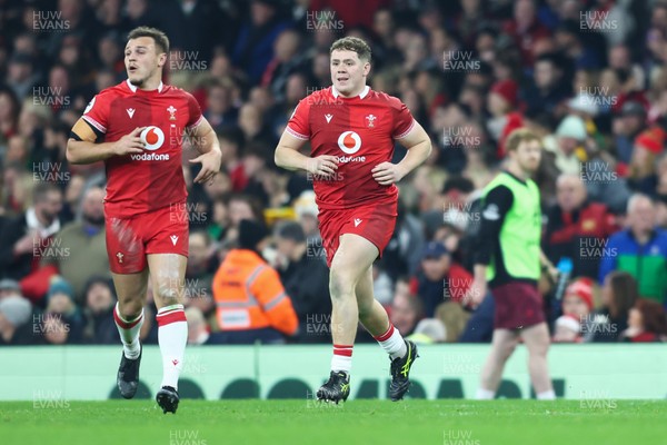 221125 - Wales v New Zealand - Quilter Nations Series - Brodie Coghlan of Wales runs on to the pitch to win his first cap