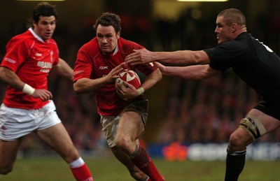 25.11.06 - Wales v New Zealand - Invesco Perpetual Series 2006 - Wales' Mark Jones is tackled by New Zealand's Keith Robinson 