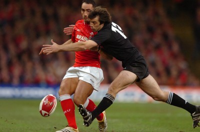 25.11.06  Wales v New Zealand Wales Sonny Parker is tackled by Conrad Smith 
