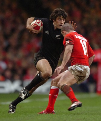 25.11.06  Wales v New Zealand All Blacks Conrad Smith goes past Shane Williams 