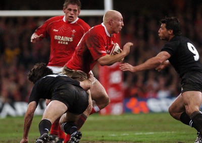 25.11.06 - Wales v New Zealand Wales' Tom Shanklin tries to get past Conrad Smith and Byron Kelleher 