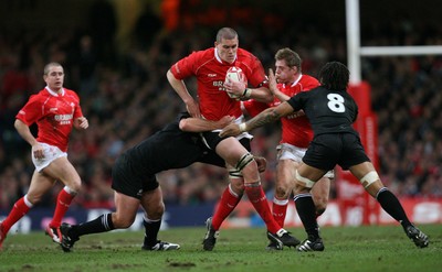 25.11.06..Wales v New Zealand, Invesco Perpetual Series '06 Wales' Ian Evans is tackled by Anton Oliver and Rodney So'oialo 