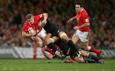 25.11.06..Wales v New Zealand, Invesco Perpetual Series '06 Wales' Kevin Morgan is tackled by the New Zealand defence 