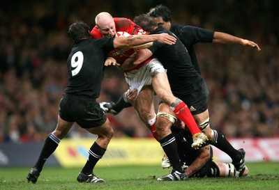 25.11.06..Wales v New Zealand, Invesco Perpetual Series '06 Wales' Tom Shanklin is swamped by the New Zealand defence 