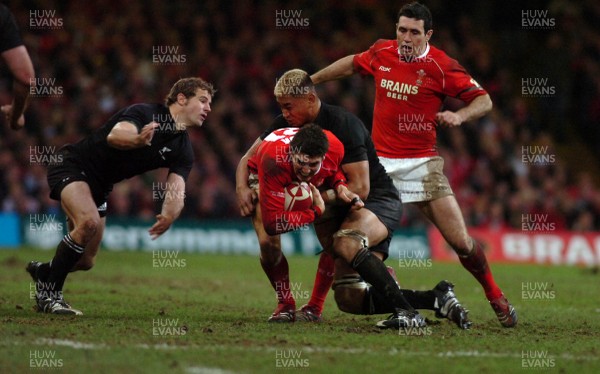 25.11.06 - Wales v New Zealand - Invesco Perpetual Series 2006 - Wales' James Hook is tackled by New Zealand's Jerry Collins 