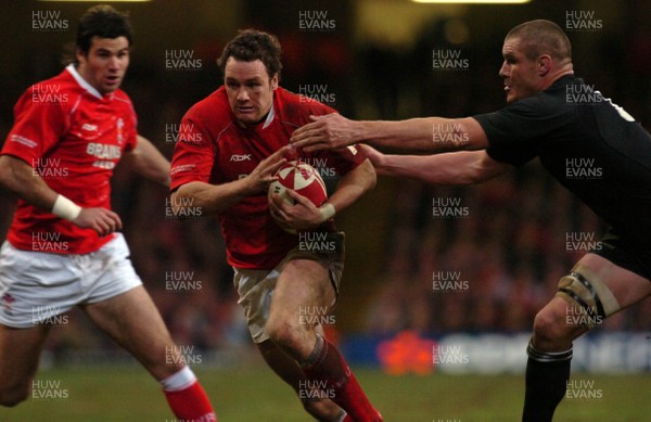 25.11.06 - Wales v New Zealand - Invesco Perpetual Series 2006 - Wales' Mark Jones is tackled by New Zealand's Keith Robinson 