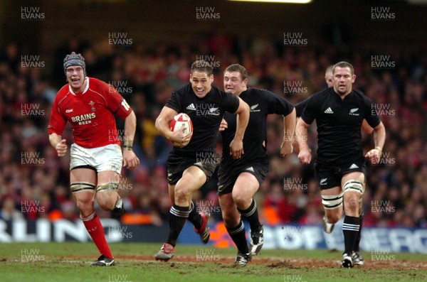 25.11.06  Wales v New Zealand All Blacks Luke McAlister breaks with full support 