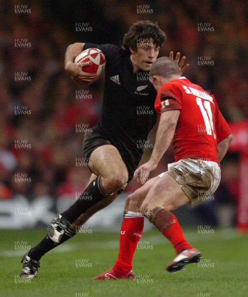 25.11.06  Wales v New Zealand All Blacks Conrad Smith goes past Shane Williams 