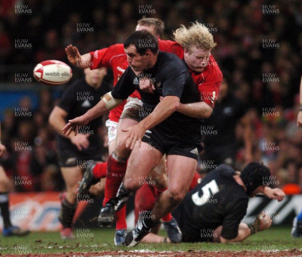 25.11.06 - Wales v New Zealand New Zealand's Carl Hayman spills the ball as Duncan Jones 