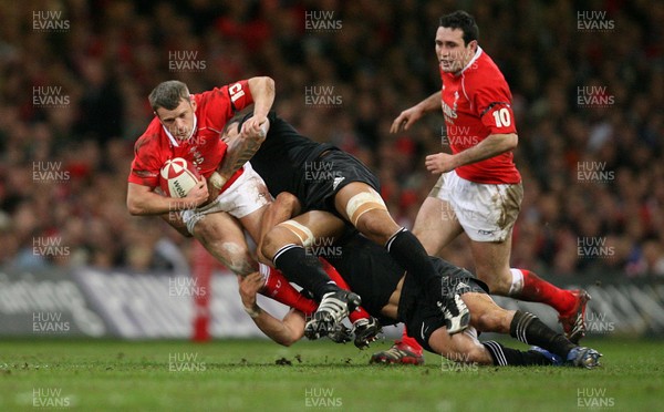 25.11.06..Wales v New Zealand, Invesco Perpetual Series '06 Wales' Kevin Morgan is tackled by the New Zealand defence 