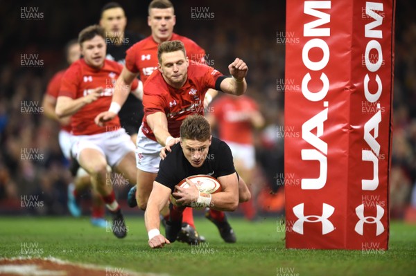 251117 - Wales v New Zealand - Under Armour Series - Beauden Barrett of New Zealand is tackled by Dan Biggar of Wales