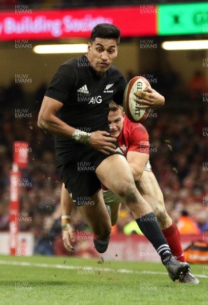 251117 - Wales v New Zealand, Under Armour 2017 Series - Rieko Ioane of New Zealand gets away from Hallam Amos of Wales