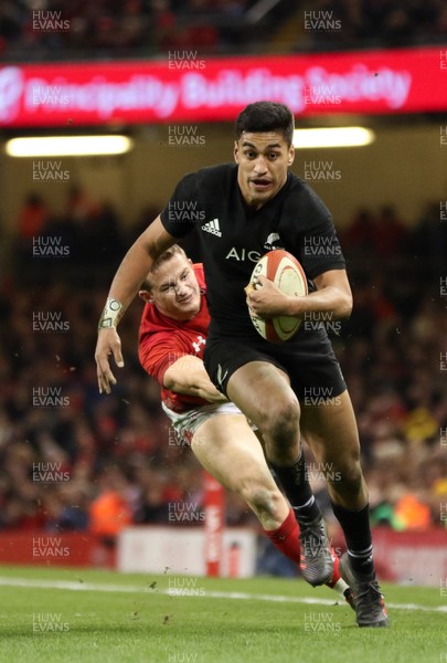 251117 - Wales v New Zealand, Under Armour 2017 Series - Rieko Ioane of New Zealand gets away from Hallam Amos of Wales