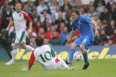 26.05.07 - Wales v New Zealand, Nationwide International Friendly Match, Wrexham New Zealand's Chris James wins the ball from Wales' Simon Davies 