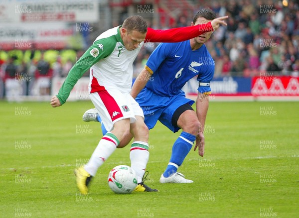 26.05.07 - Wales v New Zealand, Nationwide International Friendly Match, Wrexham Wales' Craig Bellamy fires past New Zealand's Tim Brown to scores his second goal 