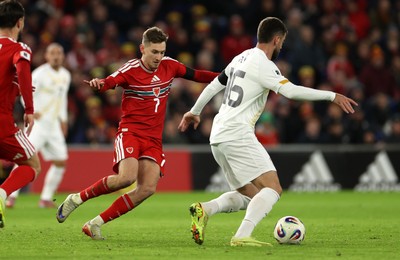 181125 - Wales v North Macedonia, FIFA World Cup European Qualifiers - Isnik Alimi of North Macedonia is challenged by David Brooks of Wales 