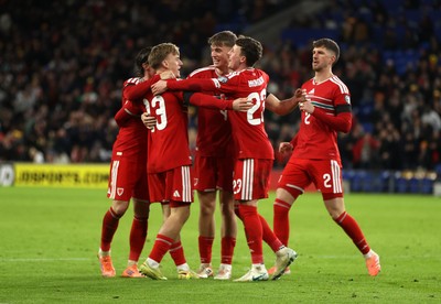 181125 - Wales v North Macedonia, FIFA World Cup European Qualifiers - Isaak Davies of Wales celebrates scoring their seventh goal with team mates