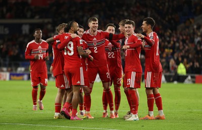 181125 - Wales v North Macedonia, FIFA World Cup European Qualifiers - Isaak Davies of Wales celebrates scoring their seventh goal with team mates