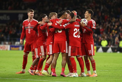 181125 - Wales v North Macedonia, FIFA World Cup European Qualifiers - Isaak Davies of Wales celebrates scoring their seventh goal with team mates