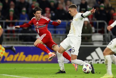 181125 - Wales v North Macedonia, FIFA World Cup European Qualifiers - Harry Wilson of Wales is challenged by Andrej Stojchevski of North Macedonia 