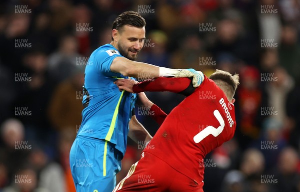 181125 - Wales v North Macedonia, FIFA World Cup European Qualifiers - David Brooks of Wales is pushed by Stole Dimitrievski of North Macedonia 