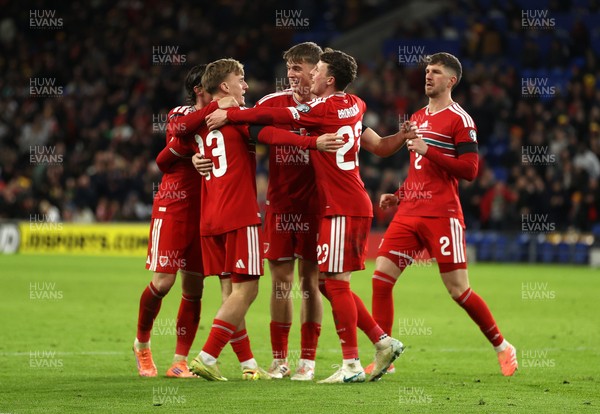 181125 - Wales v North Macedonia, FIFA World Cup European Qualifiers - Isaak Davies of Wales celebrates scoring their seventh goal with team mates