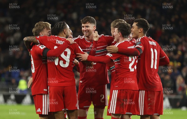 181125 - Wales v North Macedonia, FIFA World Cup European Qualifiers - Isaak Davies of Wales celebrates scoring their seventh goal with team mates