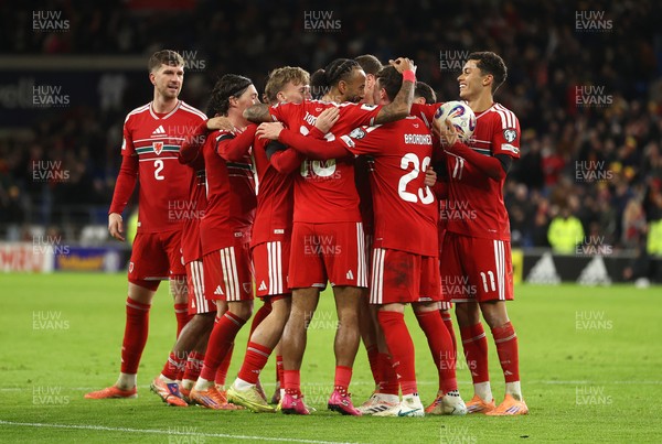 181125 - Wales v North Macedonia, FIFA World Cup European Qualifiers - Isaak Davies of Wales celebrates scoring their seventh goal with team mates