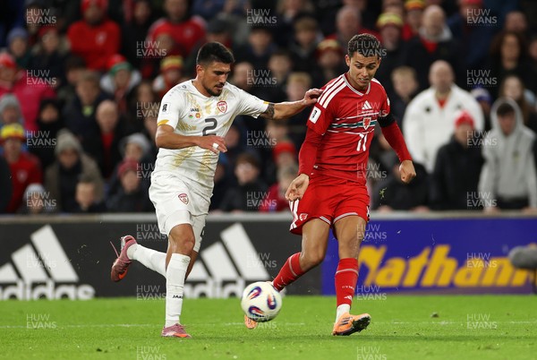 181125 - Wales v North Macedonia, FIFA World Cup European Qualifiers - Brennan Johnson of Wales is challenged by Bojan Ilievski of North Macedonia 
