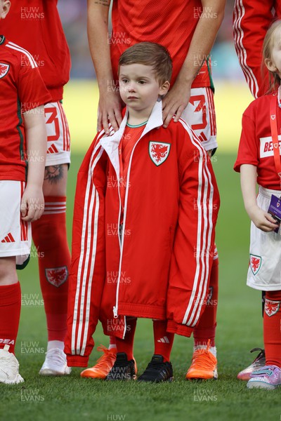 060423 - Wales v Northern Ireland - Women�s International Friendly - Young mascot wearing an oversized Wales coat during the anthems