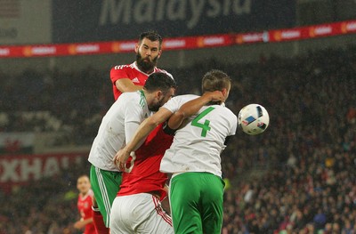 240316 - Vauxhall International Friendly - Wales v Northern Ireland -Joe Ledley of Wales gets a header on goal