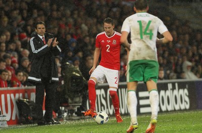 240316 - Vauxhall International Friendly - Wales v Northern Ireland -Chris Gunter of Wales takes on Stuart Dallas of Northern Ireland