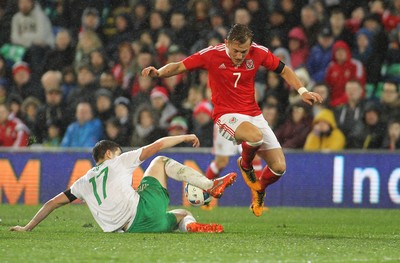 240316 - Vauxhall International Friendly - Wales v Northern Ireland -George Williams of Wales is tackled by Paddy McNair of Northern Ireland of Northern Ireland