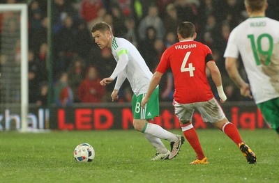 240316 - Vauxhall International Friendly - Wales v Northern Ireland -Steven Davis of Northern Ireland looks for support under pressure from David Vaughan of Wales