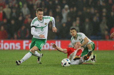 240316 - Vauxhall International Friendly - Wales v Northern Ireland -Steven Davis of Northern Ireland beats Jonathan Williams of Wales