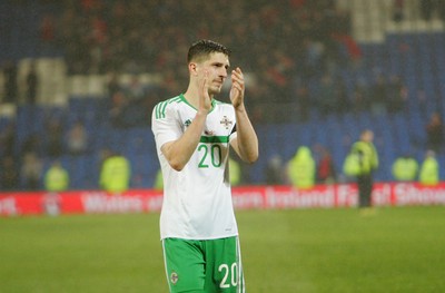 240316 - Vauxhall International Friendly - Wales v Northern Ireland -Craig Cathcart of Northern Ireland applauds the travelling fans
