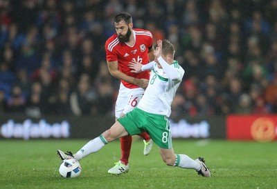 240316 - Wales v Northern Ireland, International Friendly - Joe Ledley of Wales tangles with Steven Davis of Northern Ireland