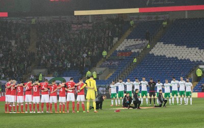 240316 - Wales v Northern Ireland, International Friendly - Teams line up for a minutes silence in memory of those caught up in the terrorist attack in Brussels