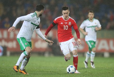 240316 - Wales v Northern Ireland, International Friendly - Tom Lawrence of Wales takes on Conor McLaughlin of Northern Ireland