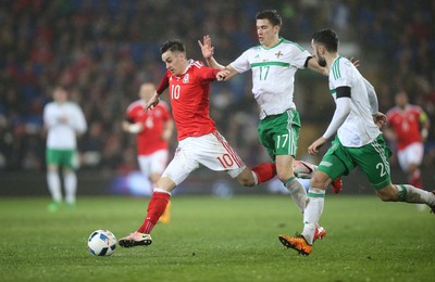 240316 - Wales v Northern Ireland, International Friendly - Tom Lawrence of Wales gets between Patrick McNair of Northern Ireland and Conor McLaughlin of Northern Ireland