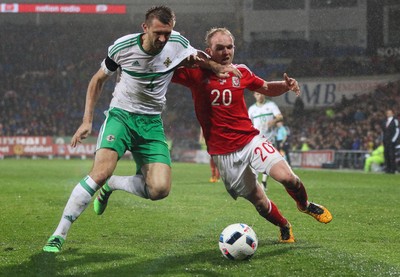 240316 - Wales v Northern Ireland, International Friendly - Jonathan Williams of Wales and Gareth McAuley of Northern Ireland compete for the ball